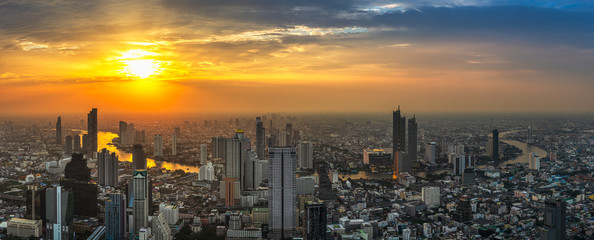 Skyscraper on cityscape at Chaopraya river in Bangkok metropolis Thailand on sunset time