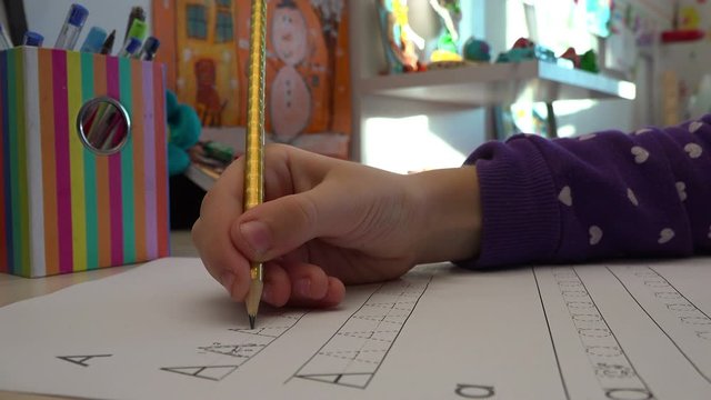 Little kid Learning To Write Letters, close up