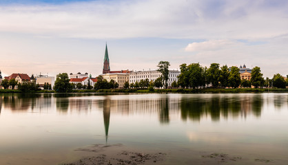 Cityscape of historic centre of Schwerin and Burgsee lake, Germany. Long exposure