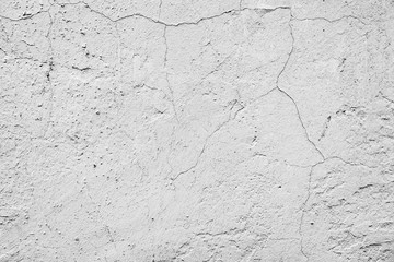 Texture of a concrete wall with cracks and scratches which can be used as a background