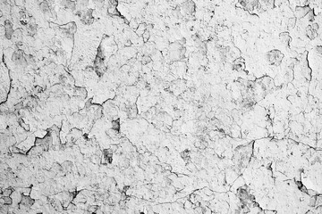 Texture of a concrete wall with cracks and scratches which can be used as a background