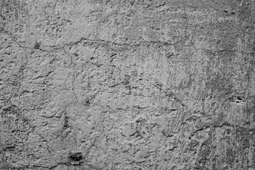 Texture of a concrete wall with cracks and scratches which can be used as a background