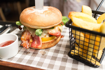 Bacon hamburger set on check paper