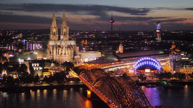 cologne cathedral and city center by night aerial view zoom in