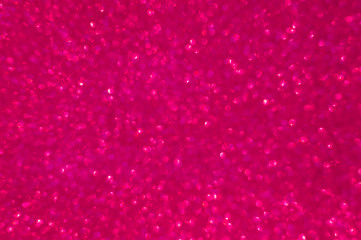 Abstract pink glitter blur background. Defocus dark background for Valentine's day.