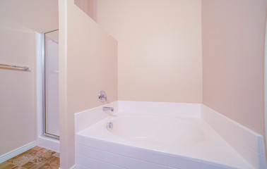 Interior of a small bright bathroom with bathtub
