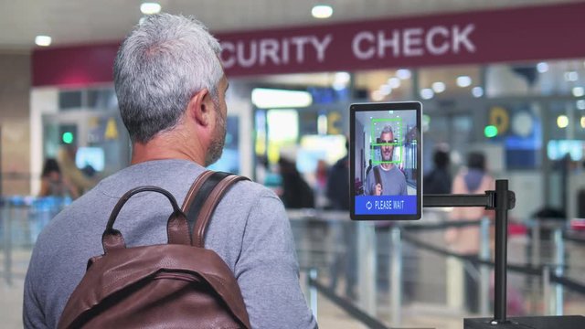 airport security man goes through facial recognition system control new technology 4k