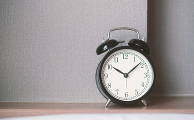 Alarm clock on grey background with copy space for you design.