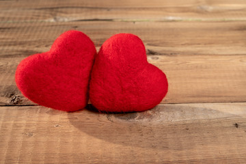 Close up of red hearts on wooden table. St. Valentine's Day background