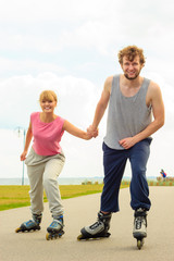 roller skater couple skating outdoor