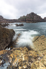 movement of water on rock by the sea