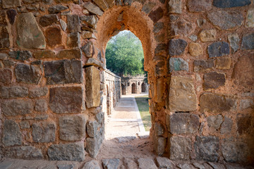 Stone arch window at Isa Khans Garden Tomb, part of Humayan's Tomb, in New Delhi India