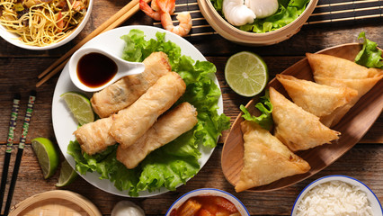 assorted of asian food, spring roll- samossa- dim sum- fried noodles - obrazy, fototapety, plakaty