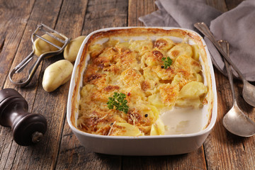 gratin dauphinois, baked potato with cream and cheese