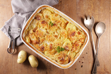 gratin dauphinois, baked potato with cream and cheese