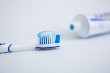 Toothbrush with colored toothpaste, care for the oral cavity and teeth, vector.