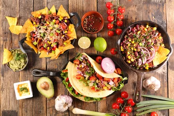 Wall murals Food assorted of mexican food with fajitas, chili con carne and nachos with avocado, beef and cheese