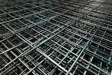 Steel bar for building materials. Wire reinforcing mesh. Industrial grunge background.