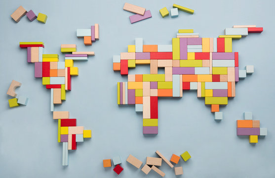 World map made from colorful wooden toy blocks.