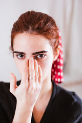 young woman with beauty face in the mirror