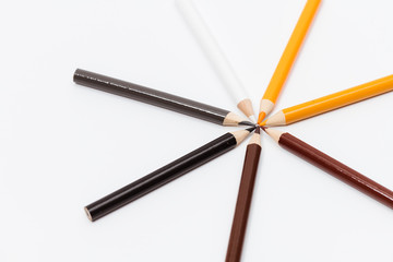Multi color pencils. the concept of a multinational family and equality in the world.