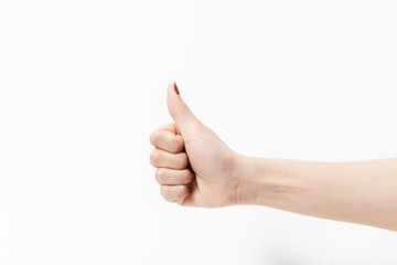 A woman hand in like symbol gesture on a white background