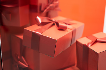 lifestyle and birthday present concept - Luxury holiday gifts on red