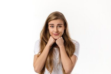 Portrait of young happy woman dreaming about something on white background
