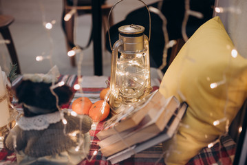 window decoration in a cafe with a lamp and tangerines