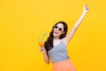 Happy woman in summer casual clothes with glass of fruit juice drink