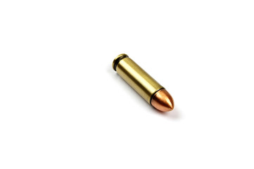 one single pistol bullet on a white background 