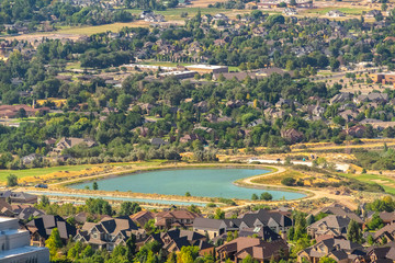 Haert shaped lake amid buildings and houses in Salt Lake City Utah suburbs