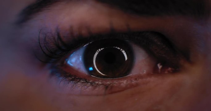 Close up of a woman's eye with beautiful make up, opening in a studio lighting. Slow motion. BMPCC 4K