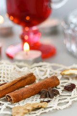 Mulled red wine with spices close up on a grey background