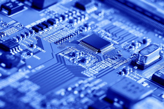 Electronic circuit board with electronic components such as chips close up. The concept of the electronic computer hardware technology.	