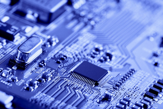 Electronic circuit board with electronic components such as chips close up. The concept of the electronic computer hardware technology.	