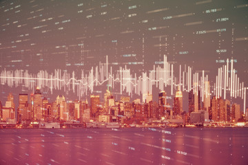 Financial graph on night city scape with tall buildings background double exposure. Analysis concept.