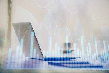 Multi exposure of chart and financial info and work space with computer background. Concept of international online trading.
