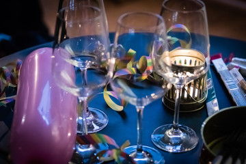 three empty wine glasses on decorated table for a party
