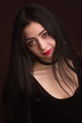 Fototapeta premium brunette on dark background dressed in goth style