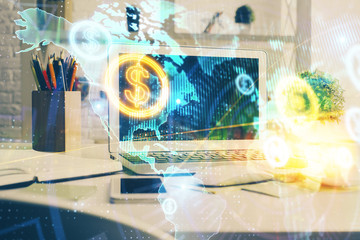 Stock market graph on background with desk and personal computer. Double exposure. Concept of financial analysis.