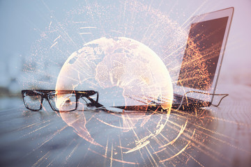 Computer on desktop with social network theme icon. Multi exposure. Concept of international connections.