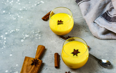 Turmeric golden milk latte with spices. Detox, immune boosting, anti inflammatory healthy cozy drink