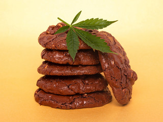 cookies with medical marijuana, cannabis drug food on yellow background