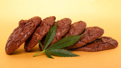 cookies with medical marijuana, cannabis drug food on yellow background
