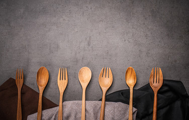 Dining accessories on the table with many clothes.