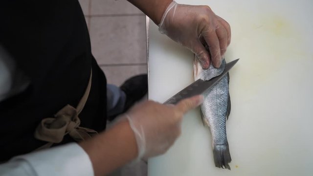 Cook slices fish