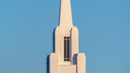 Panorama frame Modern white church steeple or spire near sunrise