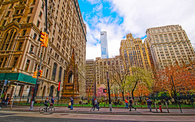 Naklejka premium Street view on Trinity Church in Financial District of Lower Manhattan, New York of USA. Skyline and cityscape with skyscrapers at United States of America, NYC, US. American architecture. Wall Street