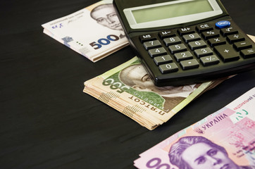 Ukrainian hryvnia and calculator. Business concept. Much money. Money background.